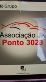 Logotipo com contorno de carro e texto "Associação JK Ponto 3023".