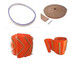 Verschiedene industrielle Heizbänder und Manschetten in Orange und Beige auf weißem Hintergrund.