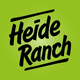 Grünes Logo mit schwarzem Text "Heide Ranch" in schwungvoller Schrift.