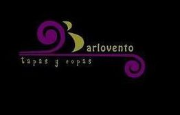 Logotipo "Barlovento tapas y copas" con diseño morado y dorado sobre fondo negro.