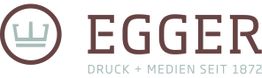Logo der Firma Egger mit Krone, Text: "Druck + Medien seit 1872" in braun und grau.