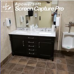 Bathroom with a sink, urinal, mirror, and tiled floor.