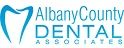 Logo of Albany County Dental Associates with a stylized tooth design in blue.