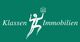 Logo von Klassen Immobilien: Silhouette einer Figur hält ein Gebäude-Icon auf grünem Hintergrund.
