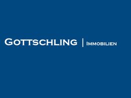 Blaues Logo mit weißer Aufschrift "Gottschling Immobilien".