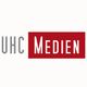 Logo mit Text: "UHC Medien" in Grau und Rot.