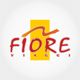 Logo con scritta "FIORE VIAGGI" in rosso su sfondo giallo con dettaglio arancione sopra.
