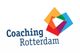 Logo met vier gekleurde vierkanten en tekst "Coaching Rotterdam".