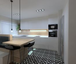 Cocina moderna con isla, lámparas colgantes y suelo de baldosas en blanco y negro.