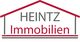 Logo der Firma Heintz Immobilien in Form eines stilisierten Hausdachs.
