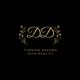 Elegant "DD" logo with floral accents and the text "Turning Dreams Into Reality."
