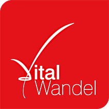 Rotes Logo mit weißem Text "Vital Wandel" und geschwungenem Häkchen über dem "V".