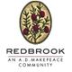 Logo of Redbrook, an A.D. Makepeace Community, featuring cranberries in an oval.