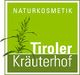 Grünes Logo mit Schriftzug "Naturkosmetik Tiroler Kräuterhof" und einer Pflanze.