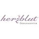 Logo der Herzblut Designagentur in lila Schrift auf weißem Hintergrund.