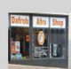 Außenansicht eines Geschäfts mit der Aufschrift "Dafrob Afro Shop" und Schaufensterdekoration.