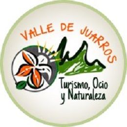 Logotipo "Valle de Juarros": flor, montañas y texto "Turismo, Ocio y Naturaleza".