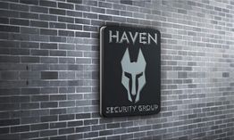 Sign with "Haven Security Group" and a wolf logo on a tiled wall.