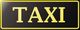 Schwarzes Schild mit gelbem Rand und der Aufschrift "TAXI" in gelben Buchstaben.