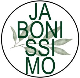 Círculo con texto "JABONISSIMO" sobre hojas verdes.
