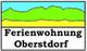 Zeichnung einer Landschaft mit Text "Ferienwohnung Oberstdorf" darunter.