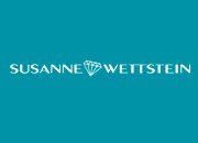 Teal Hintergrund mit weißem Text: "Susanne Wettstein", ein Diamant-Symbol in der Mitte.