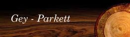 Text "Gey - Parkett" auf Holztextur mit Baumscheibe am Rand.