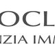 Logo Neoclassic Agenzia Immobiliare con tre barre marroni verticali a sinistra del testo.