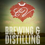 Brewing & Distilling text with a red crown and leaf logo on a sunlight background.