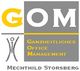 Logo von GOM: Ganzheitliches Office Management, Mechthild Storsberg, mit grauen und gelben Elementen.