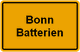 Gelbes Schild mit der schwarzen Aufschrift "Bonn Batterien".