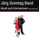 Jörg Sonntag Band: Drei Personen posieren fröhlich, Musik und Entertainment. Solo, Duo, DJ.