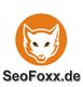 Weißer Fuchs in orangefarbenem Kreis, darunter der Text "SeoFoxx.de".