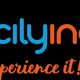 Logo "Sicilying" in blu e arancione con un cuore blu e scritta "experience it!" sotto.