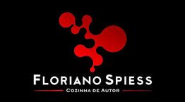 Logotipo vermelho com texto "Floriano Spiess: Cozinha de Autor" em fundo preto.