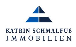 Logo von Katrin Schmalfuß Immobilien mit einem blauen, dreieckigen Symbol darüber.