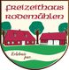 Wappen von Freizeithaus Rodemühlen mit roten Häusern, Bäumen und Schriftzug "Erlebnis pur".