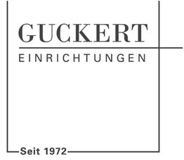 Logo von Guckert Einrichtungen, seit 1972, in schwarzem Text auf weißem Hintergrund.