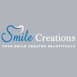 "Logo of Smile Creations with the tagline 'Your Smile Created Beautifully' on a gray background."