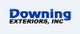 "Logo of Downing Exteriors, Inc. with blue text on a light background."