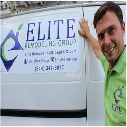 Smiling person in front of a van with "Elite Remodeling Group" sign and contact details.