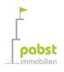 Logo von Pabst Immobilien mit grünem Schriftzug und stilisiertem Turm mit Fahne.