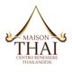 Logo di Maison Thai, centro benessere thailandese, con simbolo dorato stilizzato di un tempio.