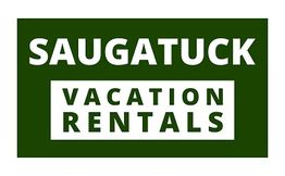 Green sign with white text: "Saugatuck Vacation Rentals."