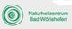 Logo des Naturheilzentrums Bad Wörishofen mit grünen Kreisen auf grauem Hintergrund.
