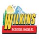 Logo of Wilkins Recreational Vehicles with mountains, trees, and birds in the background.