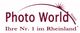 Logo von "Photo World GmbH" mit Slogan "Ihre Nr. 1 im Rheinland" und Sternmotiv im Bogen.