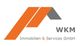 Logo von WKM Immobilien & Services GmbH mit stilisiertem Dach in Orange und Grau.