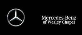 Mercedes-Benz logo next to "Mercedes-Benz of Wesley Chapel" text on black background.