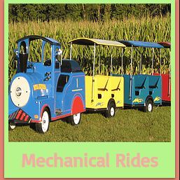 Toy train ride with colorful cars on a grassy field, labeled "Mechanical Rides."